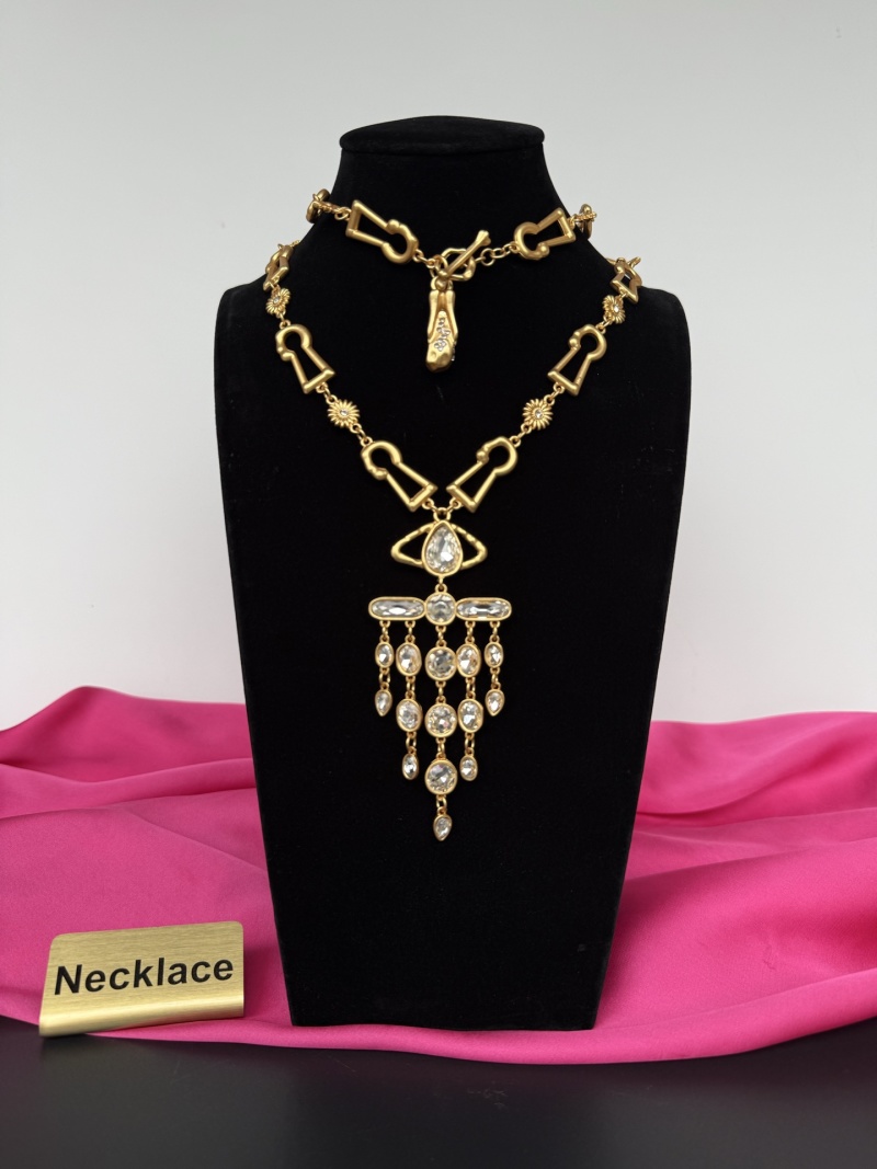 Золотистое колье с кристаллами Schiaparelli