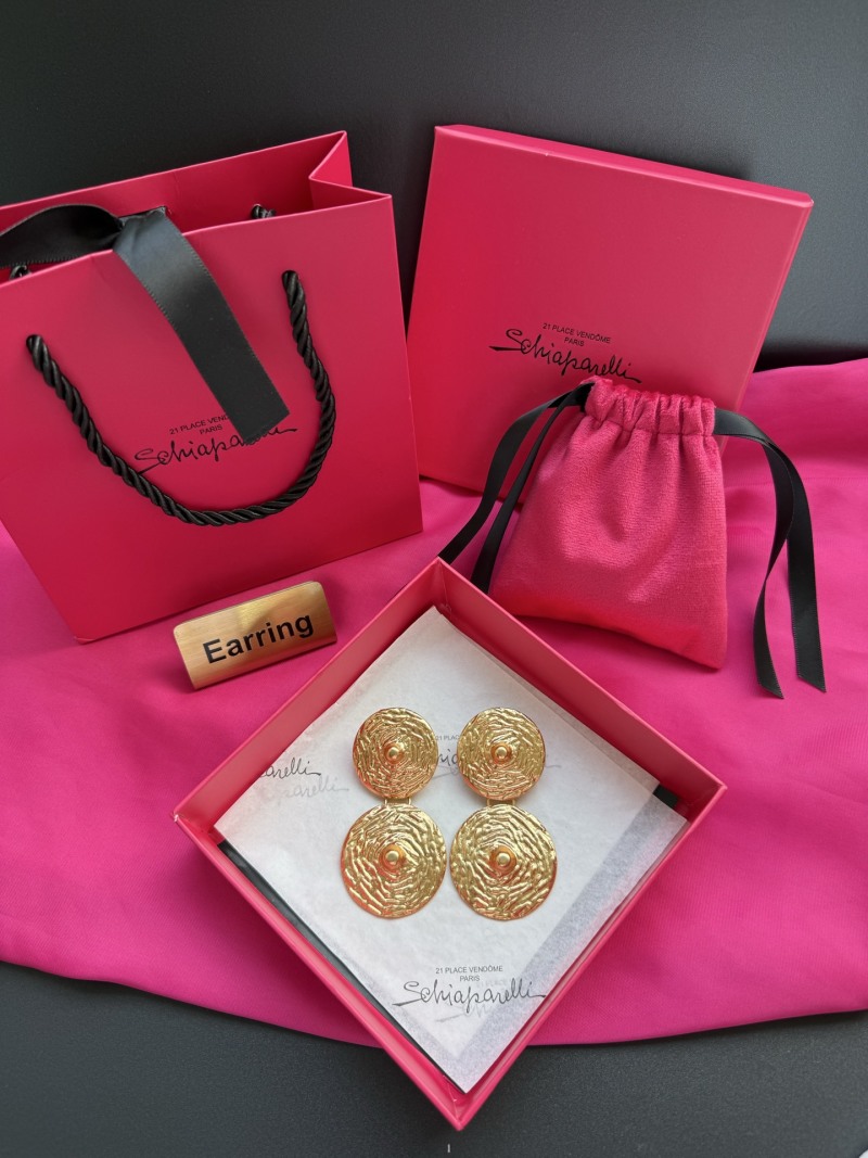 Золотистые серьги Schiaparelli