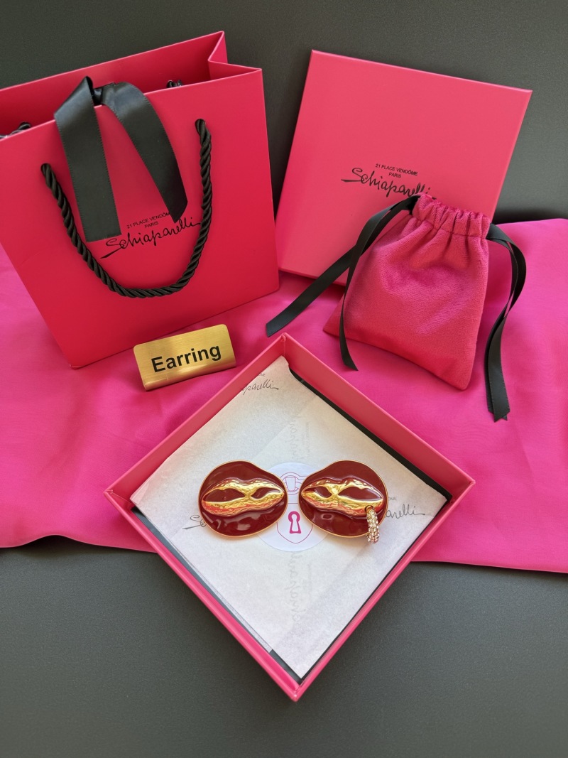 Серьги в виде масок Schiaparelli