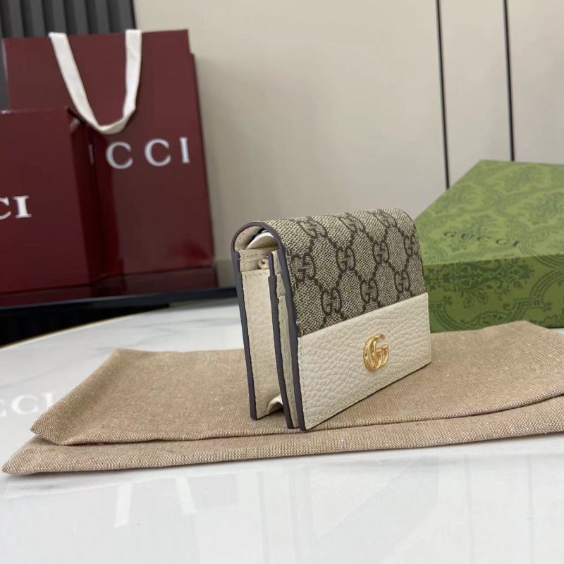 Кошелёк Gucci с монограммой и логотипом GG