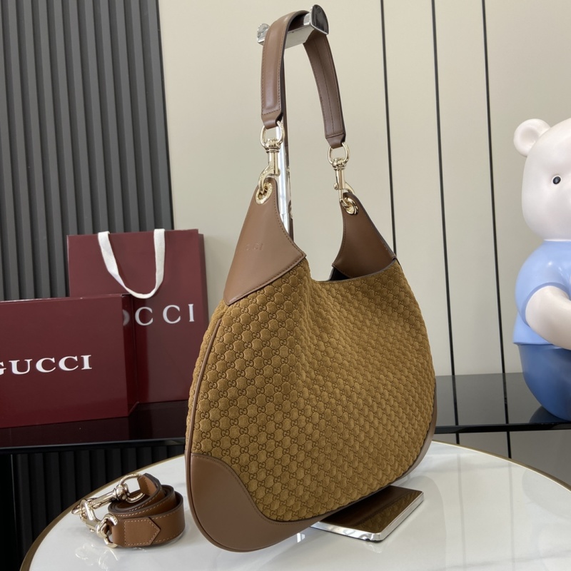 Сумка Gucci с монограммой и кожаной отделкой