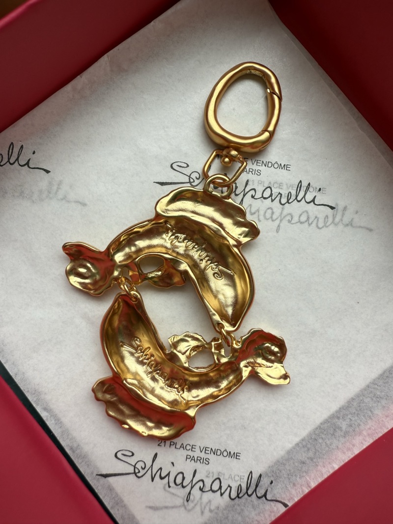 Золотистый брелок в виде двух рыб Schiaparelli