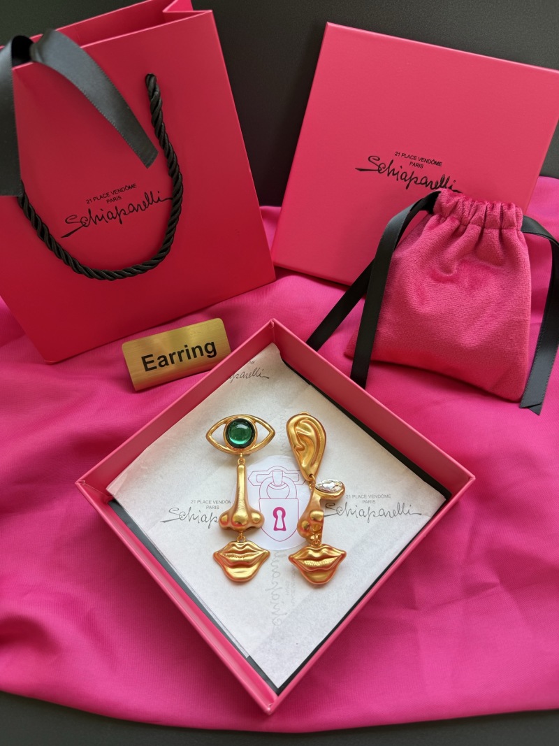 Серьги в виде уха и глаза с зелёным камнем Schiaparelli