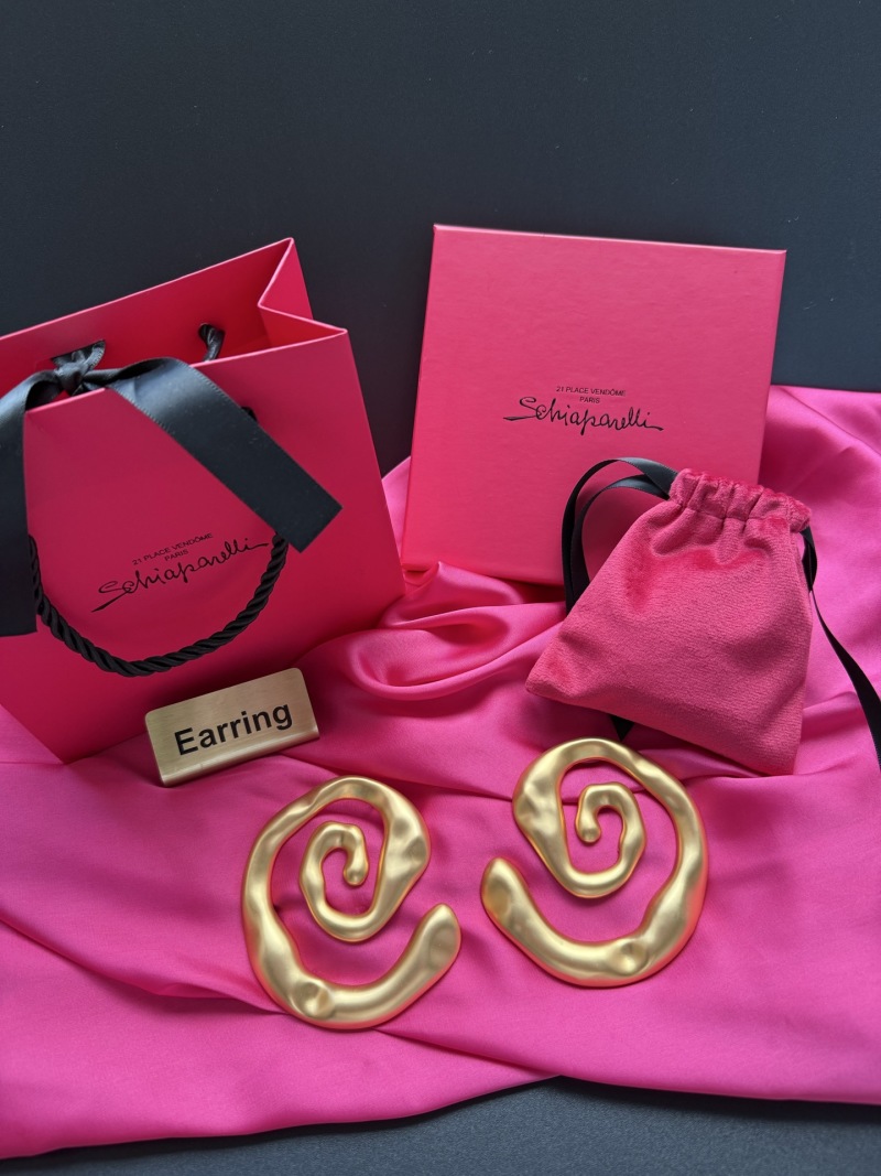 Золотистые серьги в виде спиралей Schiaparelli