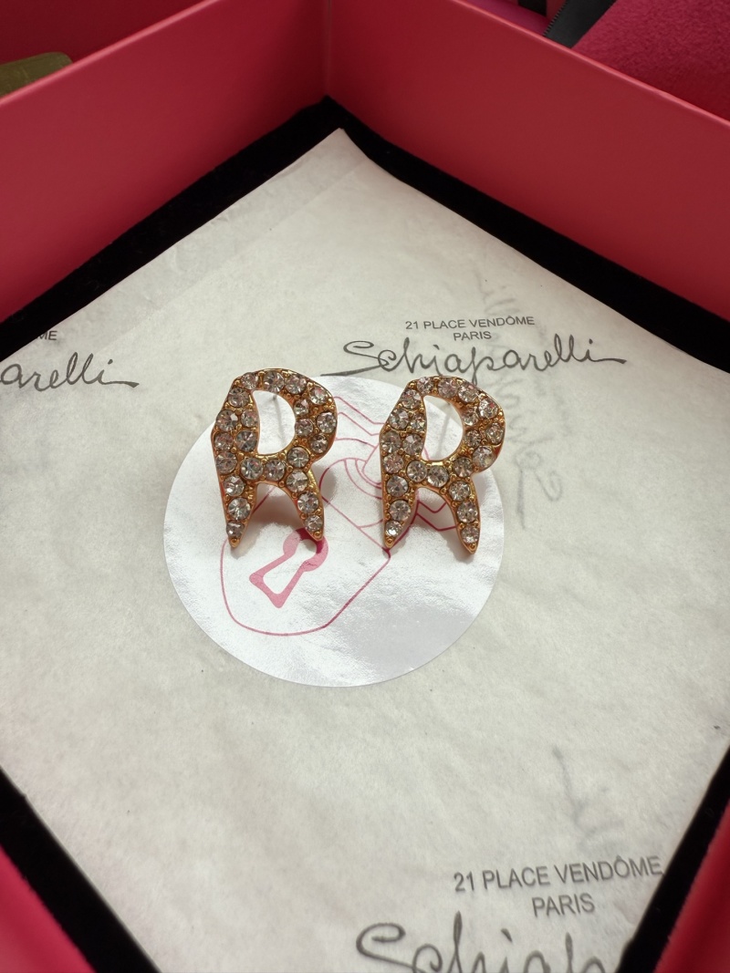 Серьги Schiaparelli в виде букв 'PR' с кристаллами