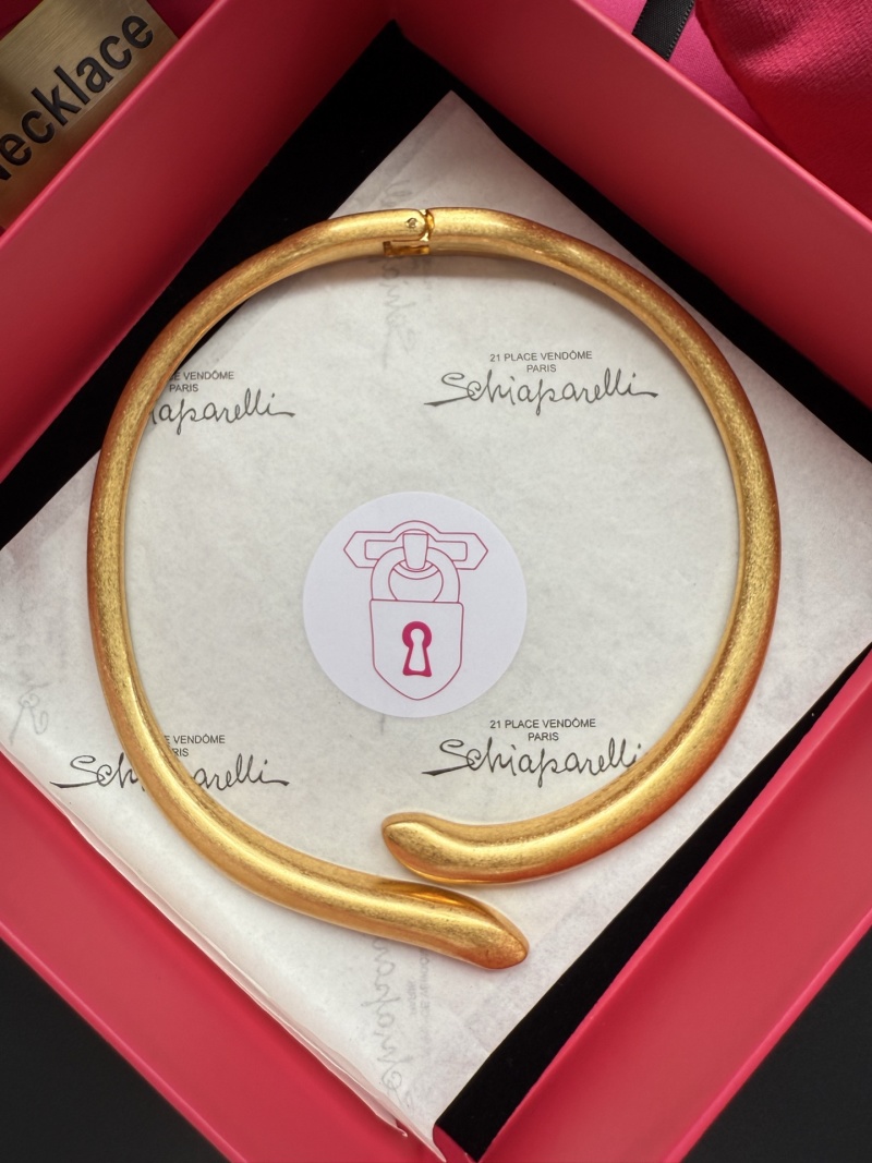 Золотистое колье в виде змеи Schiaparelli