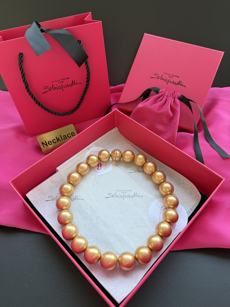 Колье из золотистых бусин Schiaparelli