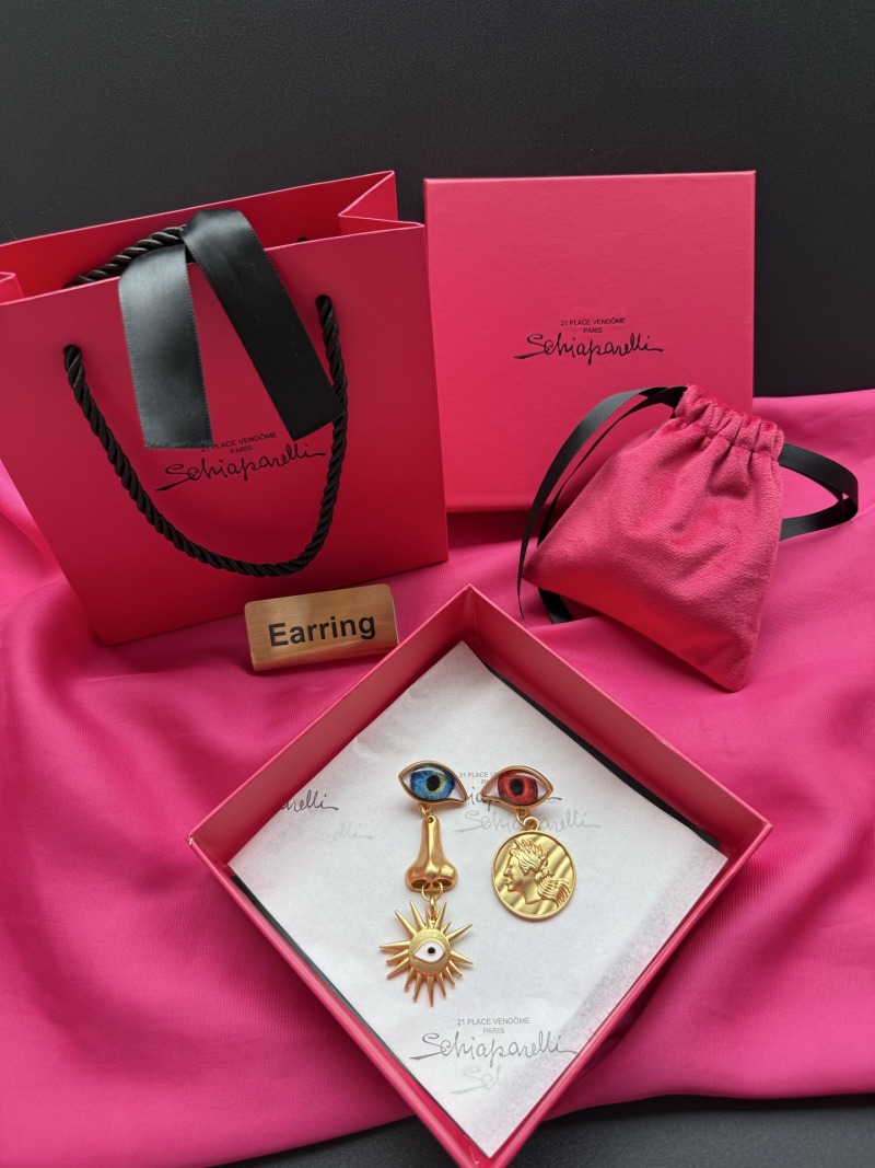 Серьги Schiaparelli с глазами и монетой