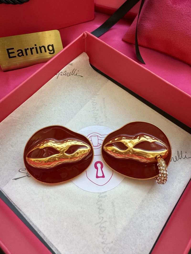 Серьги в виде масок Schiaparelli