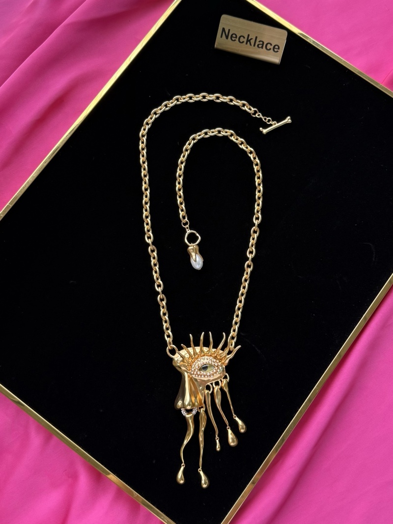 Золотистое колье с глазом и каплями Schiaparelli