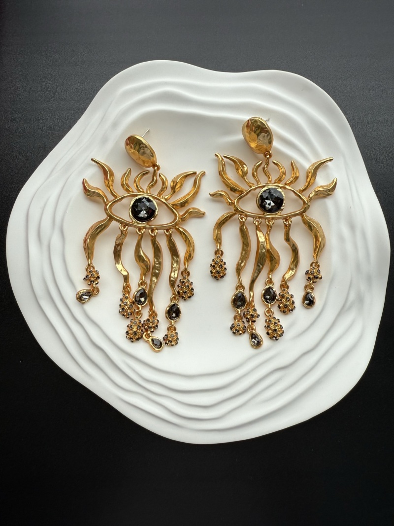 Серьги Schiaparelli с глазами и кристаллами