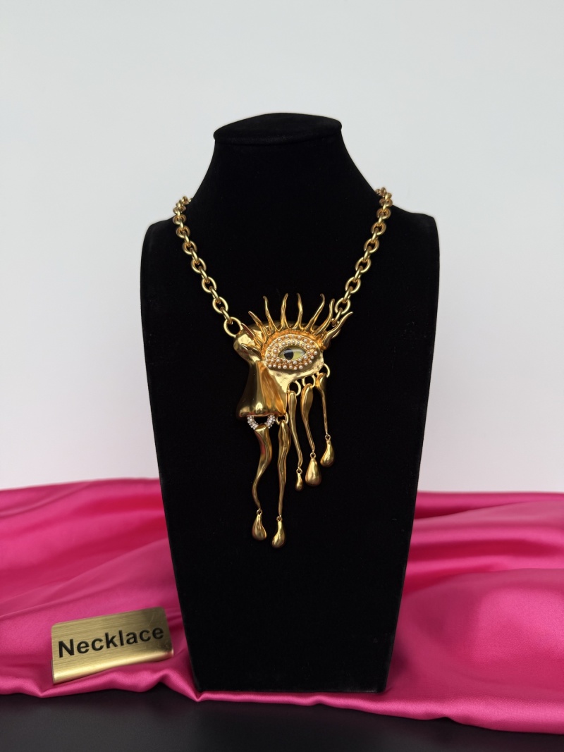 Золотистое колье с глазом и каплями Schiaparelli
