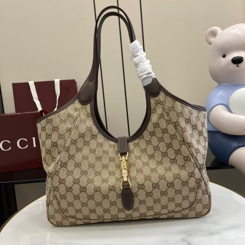 Сумка Gucci с монограммой и кожаной отделкой