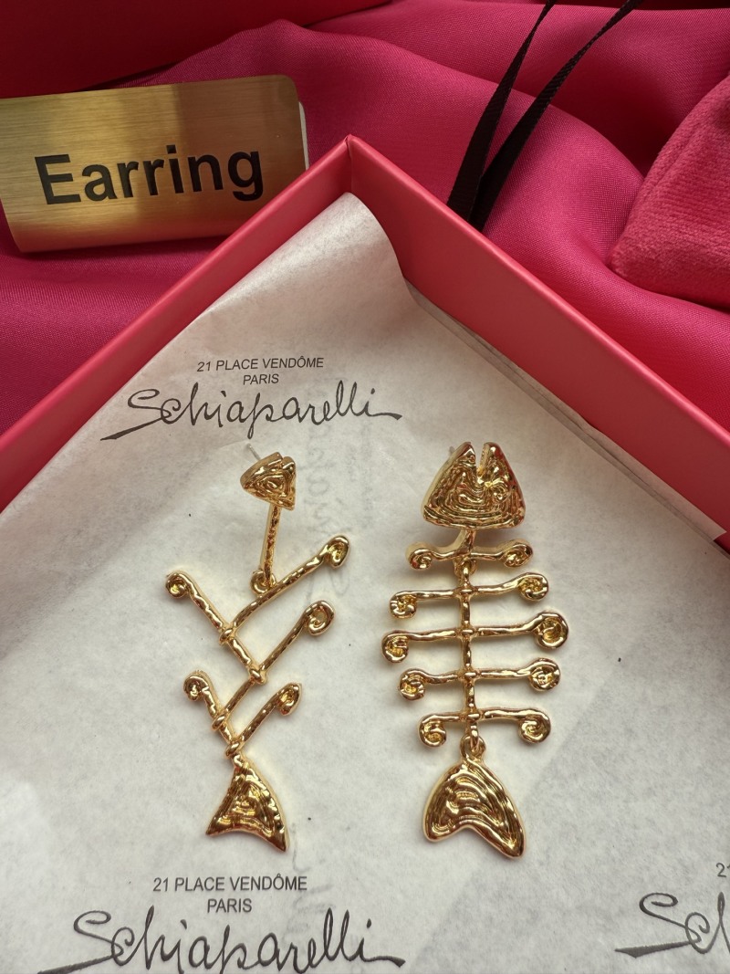 Серьги Schiaparelli в виде косточек
