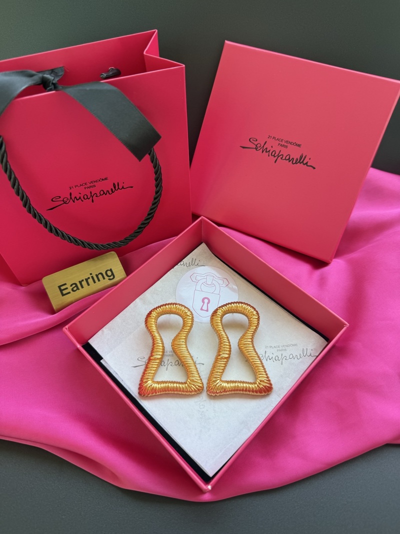 Золотистые серьги с рельефным узором Schiaparelli