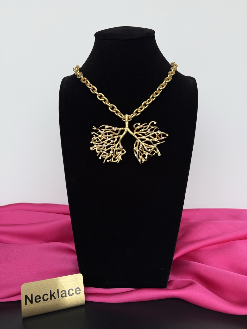 Золотистое колье с декоративным элементом в виде ветвей Schiaparelli