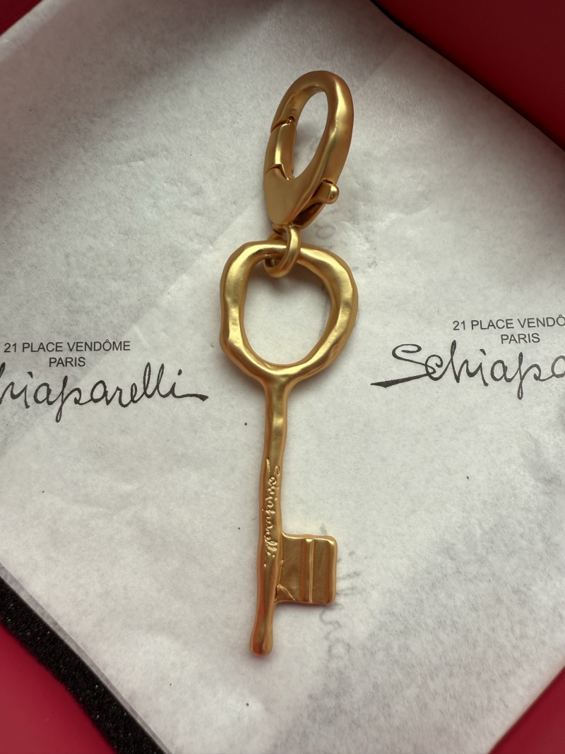 Золотистый ключевой кулон Schiaparelli