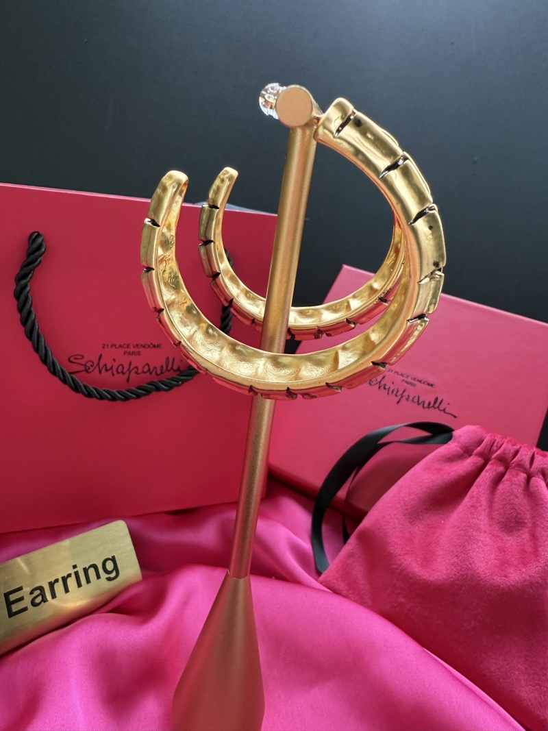 Золотистые серьги с кристаллами Schiaparelli