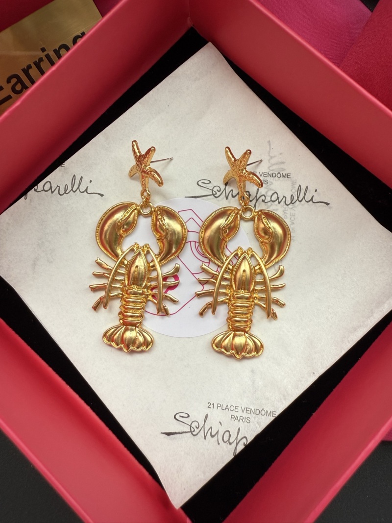 Золотистые серьги в виде крабов Schiaparelli