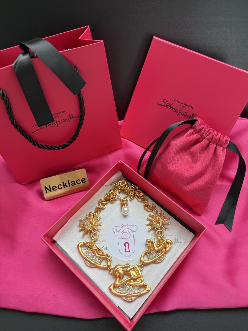 Золотистое колье с кристаллами и декоративными элементами Schiaparelli