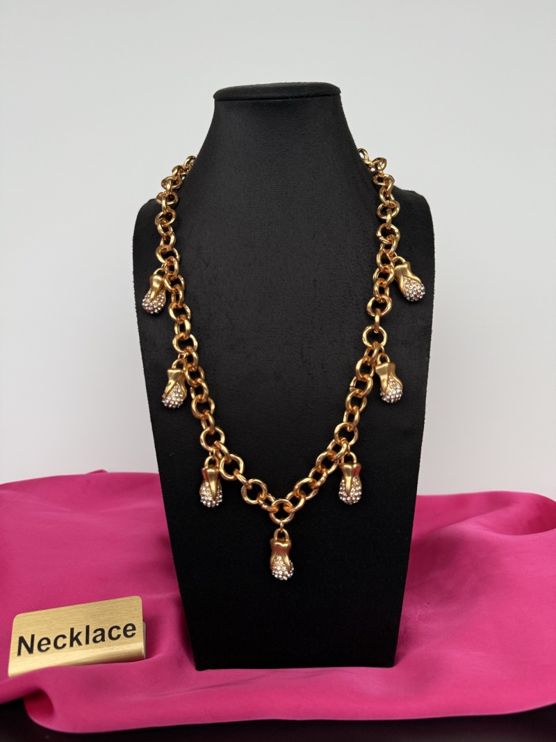 Золотистое колье с подвесками Schiaparelli