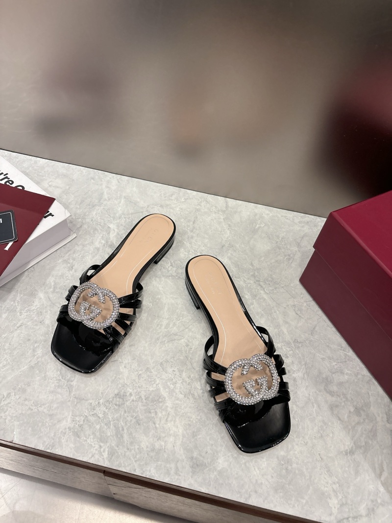 Черные женские сабо с декором в виде эмблемы Gucci