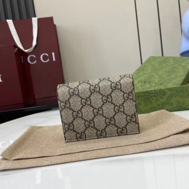 Кошелёк Gucci с монограммой и логотипом GG