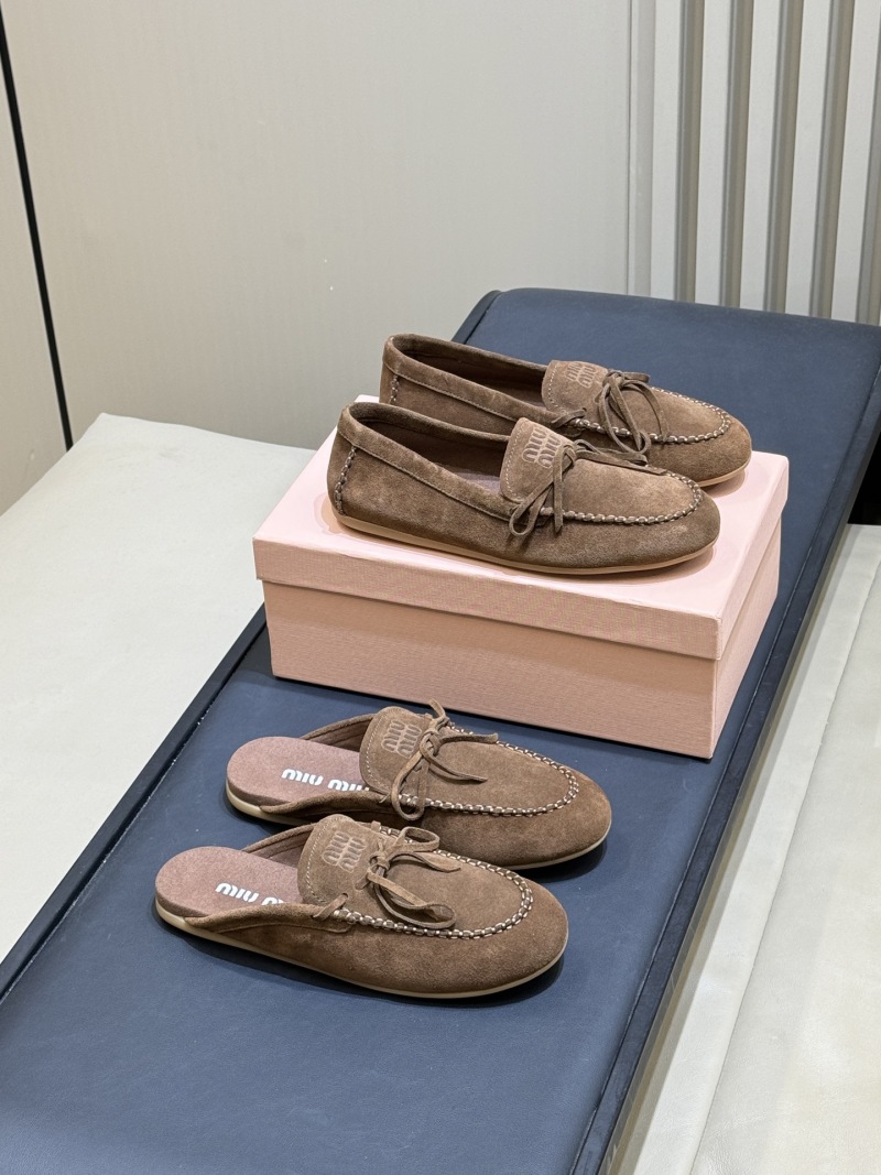 Женские замшевые мюли Miu Miu с бантом