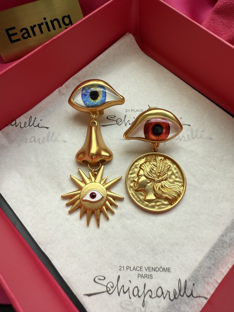 Серьги Schiaparelli с глазами и декоративными элементами