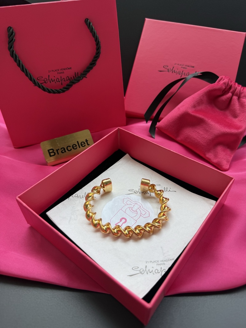 Золотистый браслет с витой цепочкой Schiaparelli