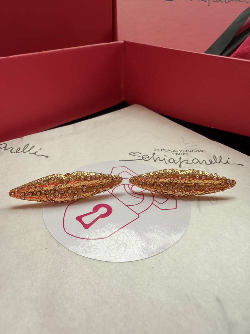 Брошь Schiaparelli