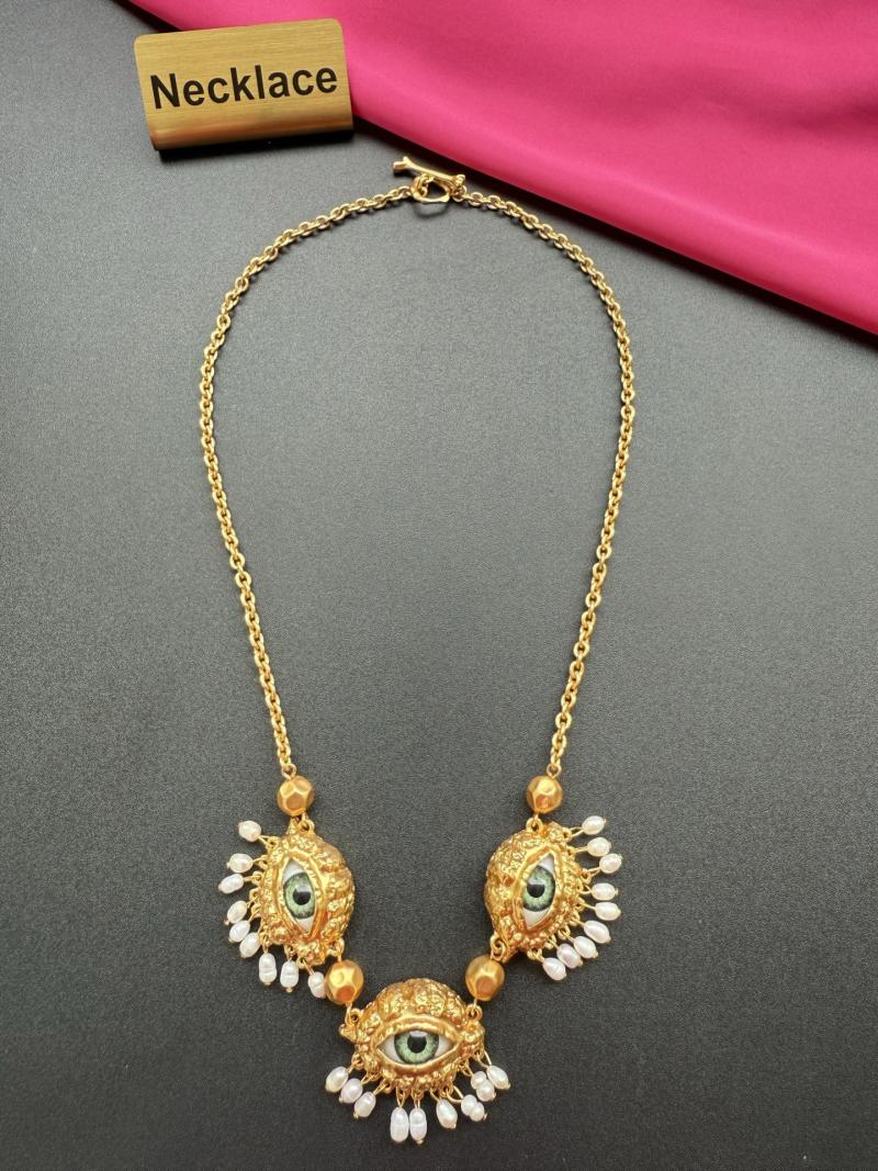 Колье с глазами и бусинами Schiaparelli